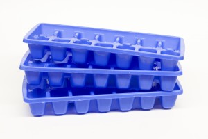 three stacked ice cube trays isolated on a white background