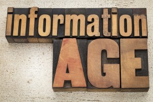 information age in vintage letterpress wood type on a grunge pa